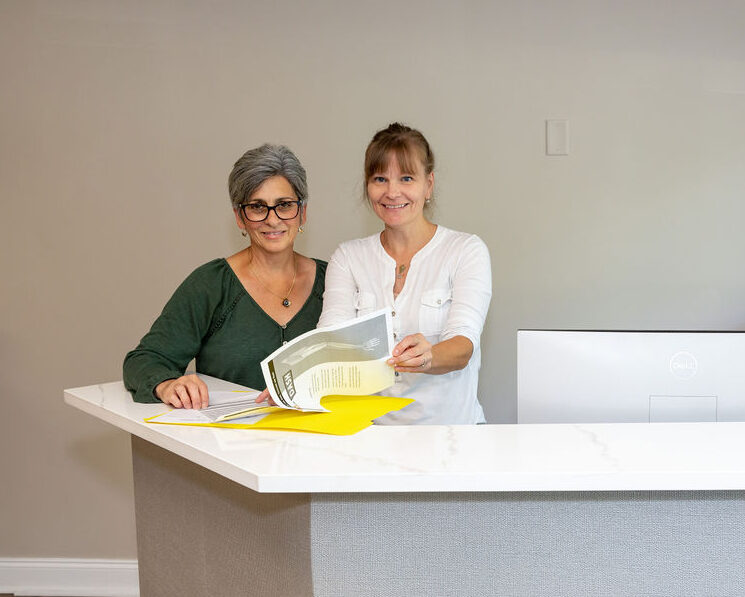 Two staff members looking at paperwork